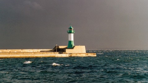 starboard pier light Sassnitz with thunderstorm in the background
